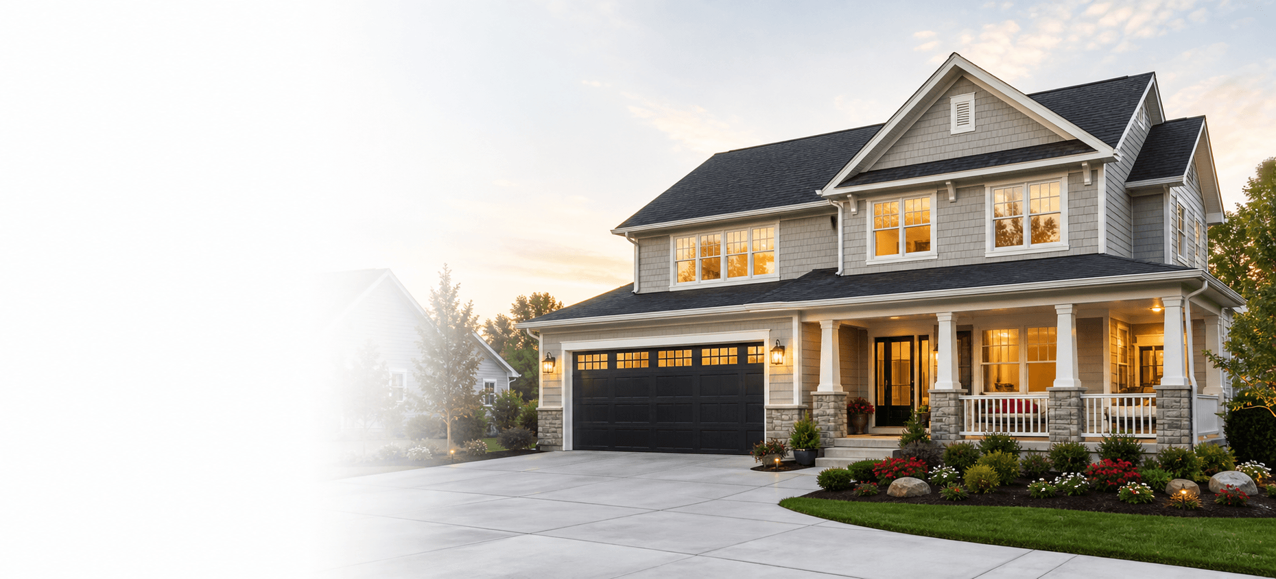 Modern residential home exterior with warm evening lighting